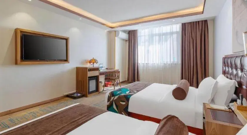 Bed in James Joyce Coffetel Lijiang Ancient City Dashuiche Bed in James Joyce Coffetel Lijiang Ancient City Dashuiche