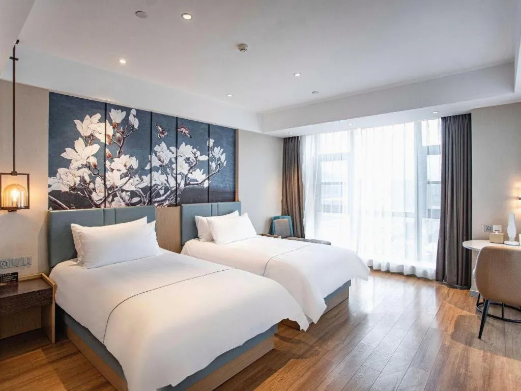 Bed in Magnotel Hotel Guangyuan Nanhe Bus Station Beijing Road