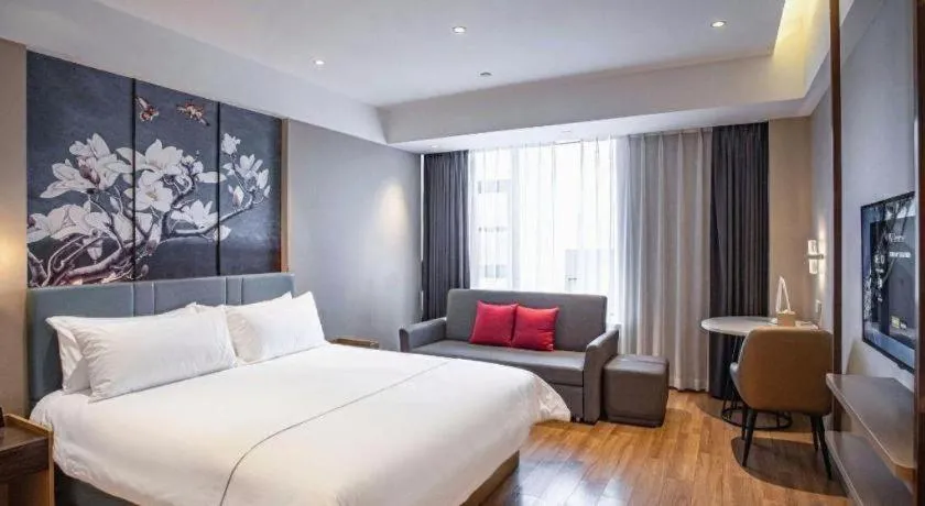 Bed in Magnotel Hotel Guangyuan Nanhe Bus Station Beijing Road