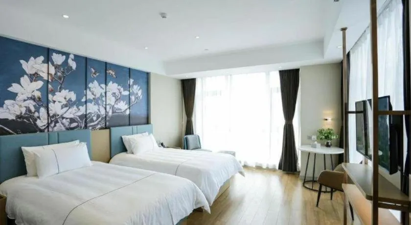 Bed in Magnotel Hotel Guangyuan Nanhe Bus Station Beijing Road