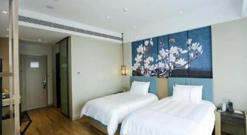 Bed in Magnotel Hotel Guangyuan Nanhe Bus Station Beijing Road