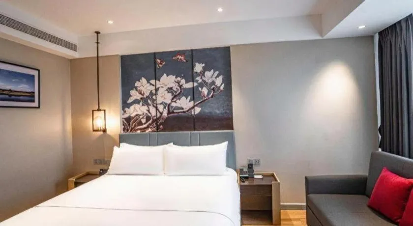 Bed in Magnotel Hotel Guangyuan Nanhe Bus Station Beijing Road