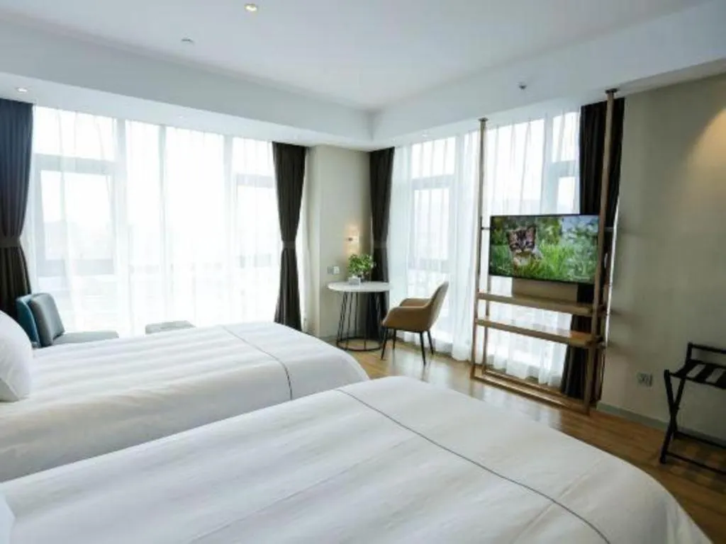 Bed in Magnotel Hotel Guangyuan Nanhe Bus Station Beijing Road