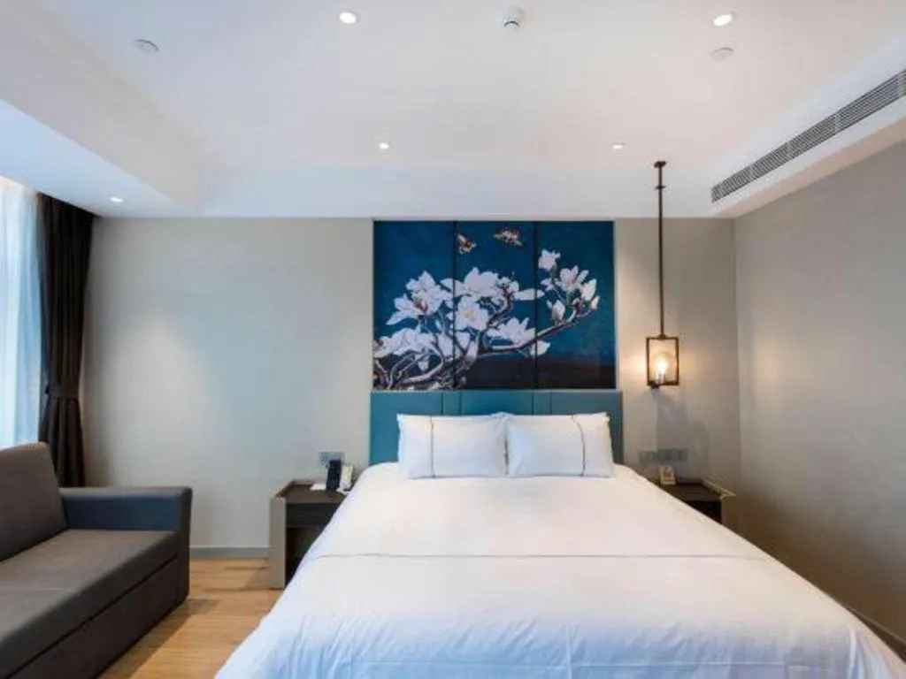 Bed in Magnotel Hotel Guangyuan Nanhe Bus Station Beijing Road