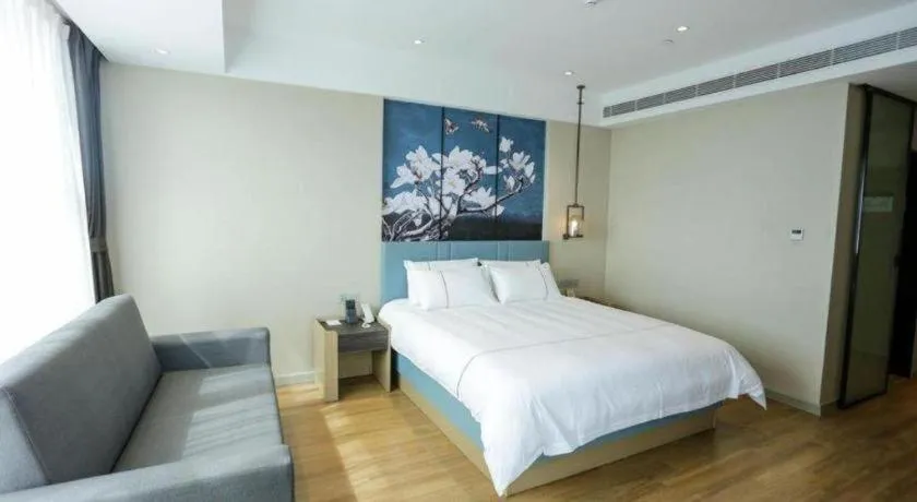 Bed in Magnotel Hotel Guangyuan Nanhe Bus Station Beijing Road