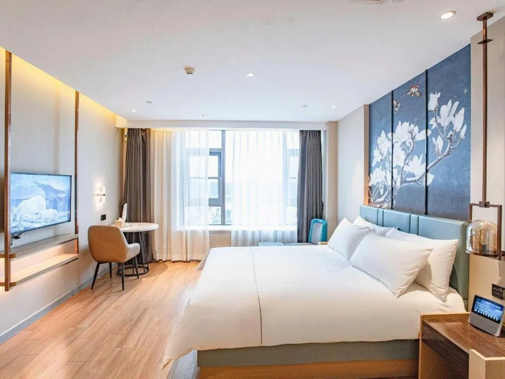 Bed in Magnotel Hotel Guangyuan Nanhe Bus Station Beijing Road