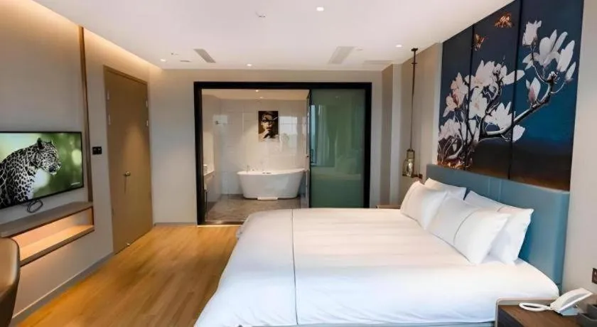 Bed in Magnotel Hotel Guangyuan Nanhe Bus Station Beijing Road