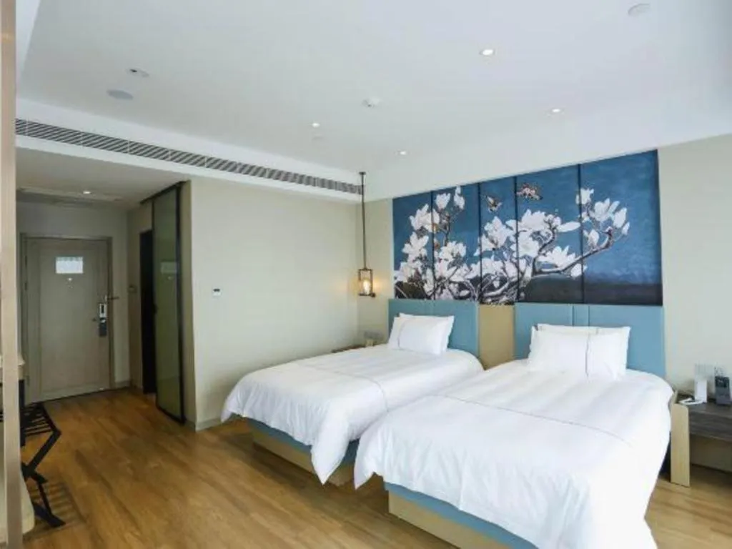 Bed in Magnotel Hotel Guangyuan Nanhe Bus Station Beijing Road