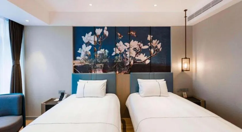 Bed in Magnotel Hotel Guangyuan Nanhe Bus Station Beijing Road