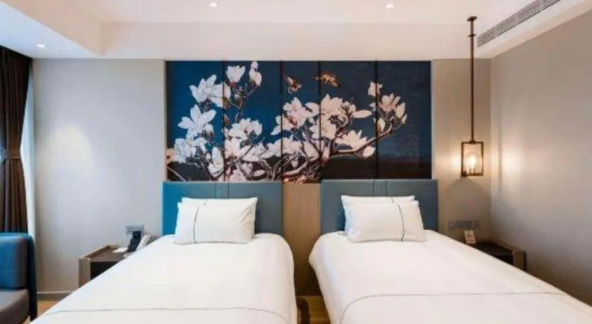 Bed in Magnotel Hotel Guangyuan Nanhe Bus Station Beijing Road