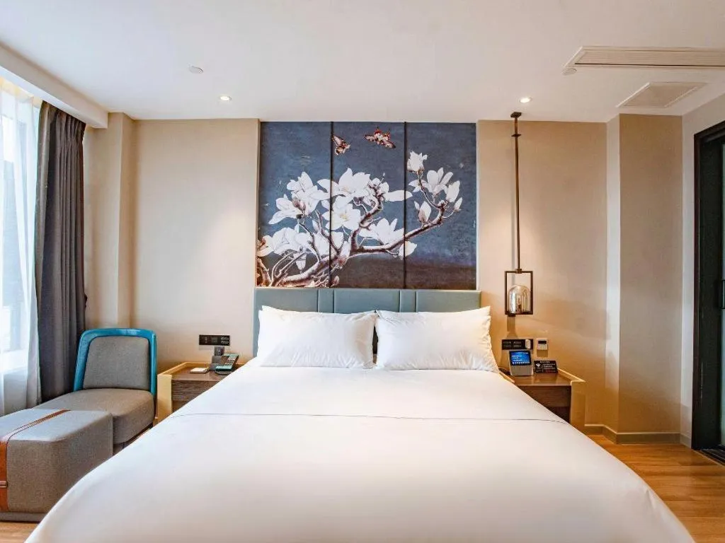 Bed in Magnotel Hotel Guangyuan Nanhe Bus Station Beijing Road