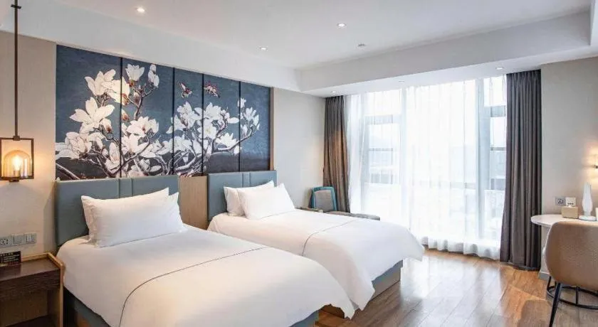 Bed in Magnotel Hotel Guangyuan Nanhe Bus Station Beijing Road