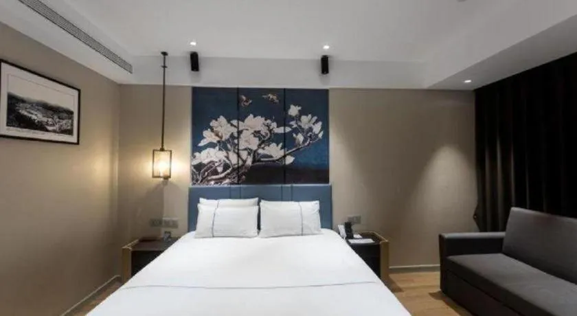 Bed in Magnotel Hotel Guangyuan Nanhe Bus Station Beijing Road