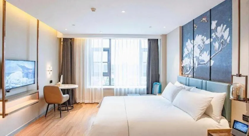 Bed in Magnotel Hotel Guangyuan Nanhe Bus Station Beijing Road