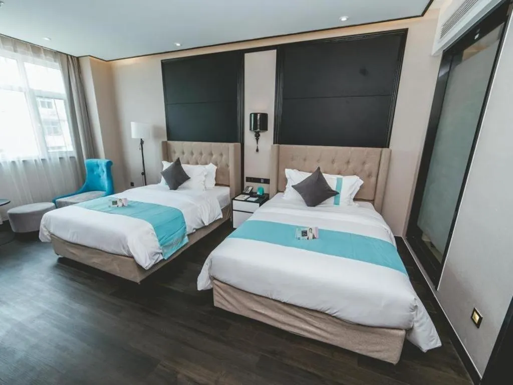 Bed in Xana Hotelle Binzhou Yangxin