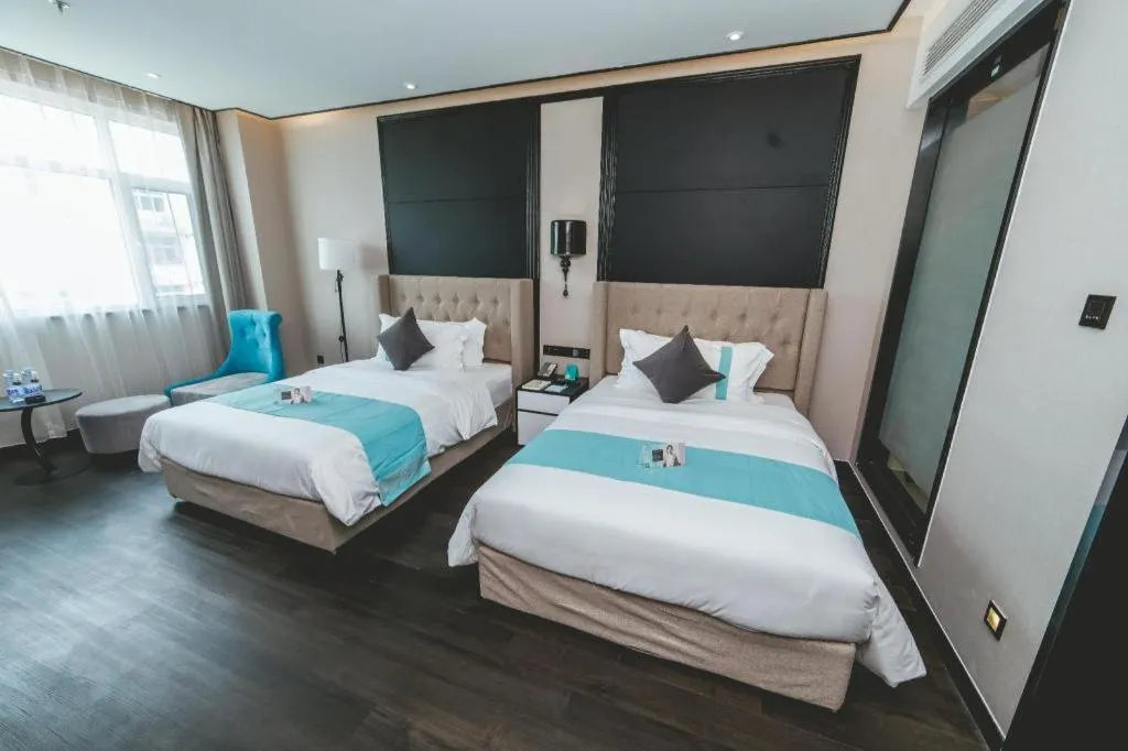 Bed in Xana Hotelle Binzhou Yangxin