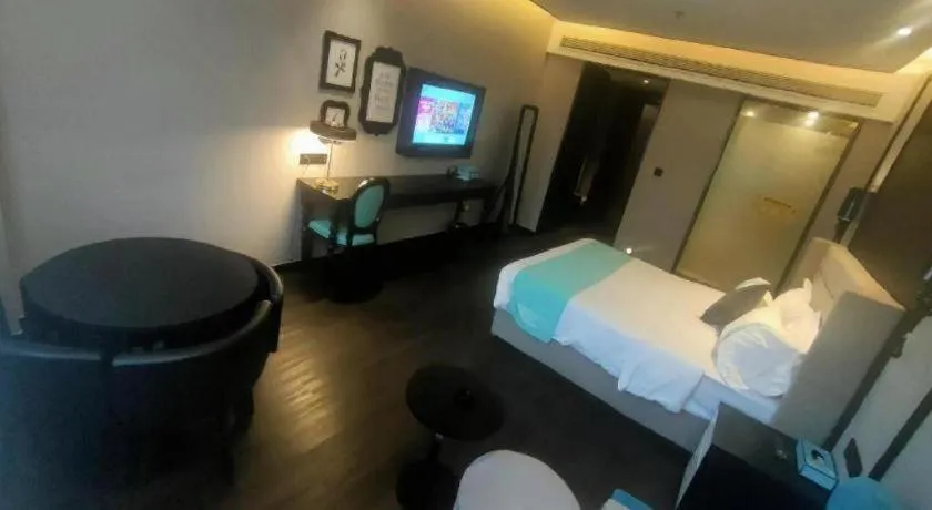 Bed in Xana Hotelle Binzhou Yangxin