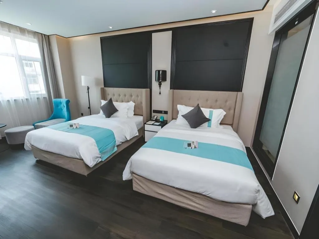 Bed in Xana Hotelle Binzhou Yangxin