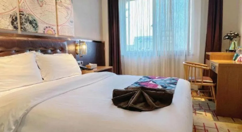 Bed in James Joyce Coffetel Taizhou Jiangyan Bus Terminal