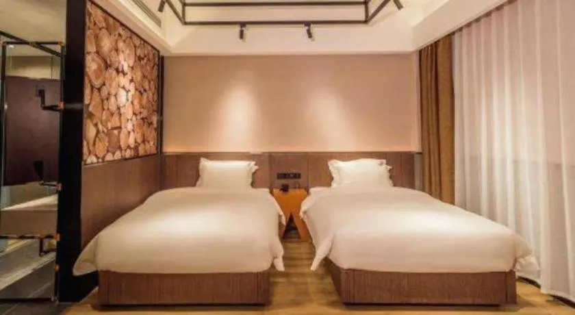 Bed in ZMAX Hotel Yan'an Baimi Avenue Baotashan
