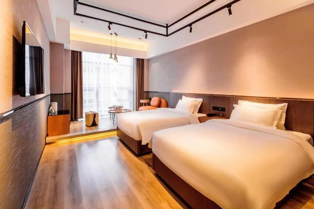 Bed in ZMAX Hotel Yan'an Baimi Avenue Baotashan