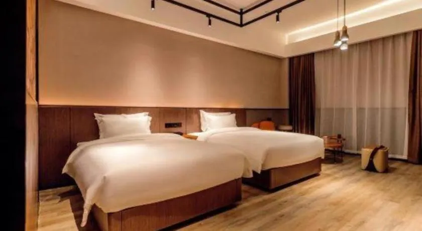 Bed in ZMAX Hotel Yan'an Baimi Avenue Baotashan