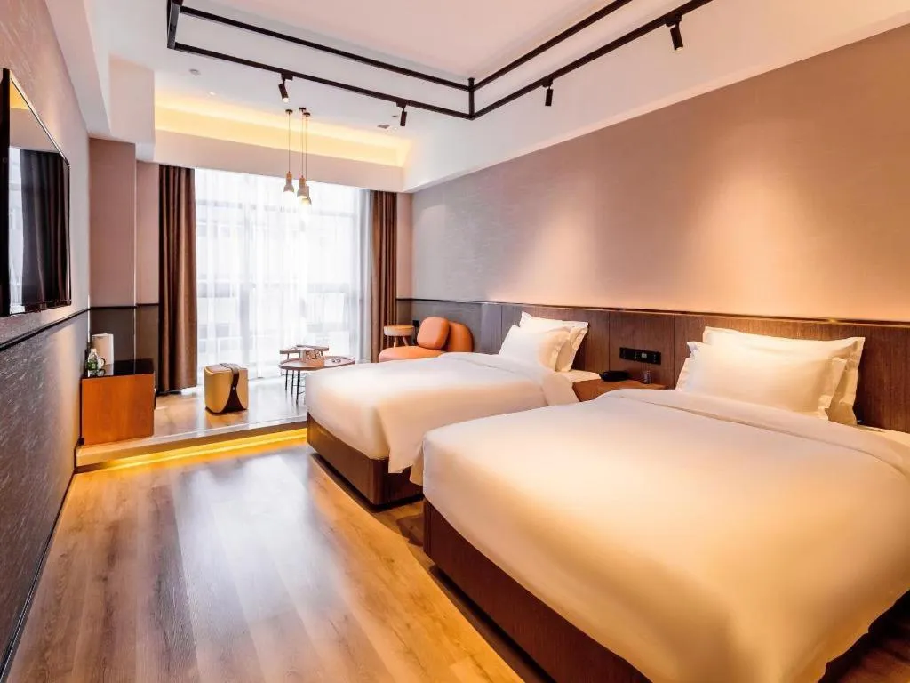 Bed in ZMAX Hotel Yan'an Baimi Avenue Baotashan