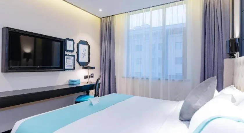 Bed in Xana Hotelle Xi'an Zhonglou Luoma