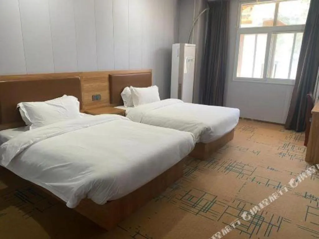 Bed in James Joyce Coffetel Beijing Yizhuang Development Zone Chicheng Times Square