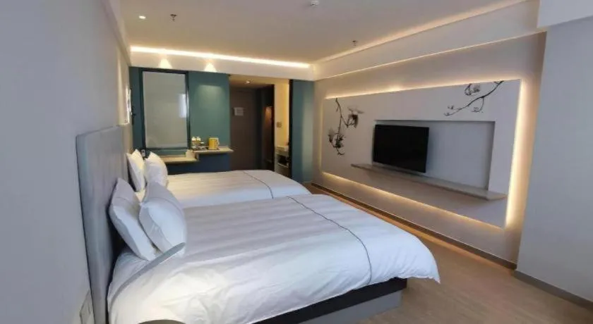 Bed in Magnotel Hotel Suzhou Wanda Plaza Huaihai Road