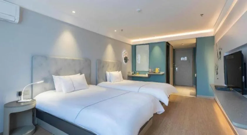 Bed in Magnotel Hotel Suzhou Wanda Plaza Huaihai Road