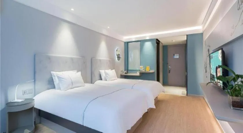 Bed in Magnotel Hotel Suzhou Wanda Plaza Huaihai Road