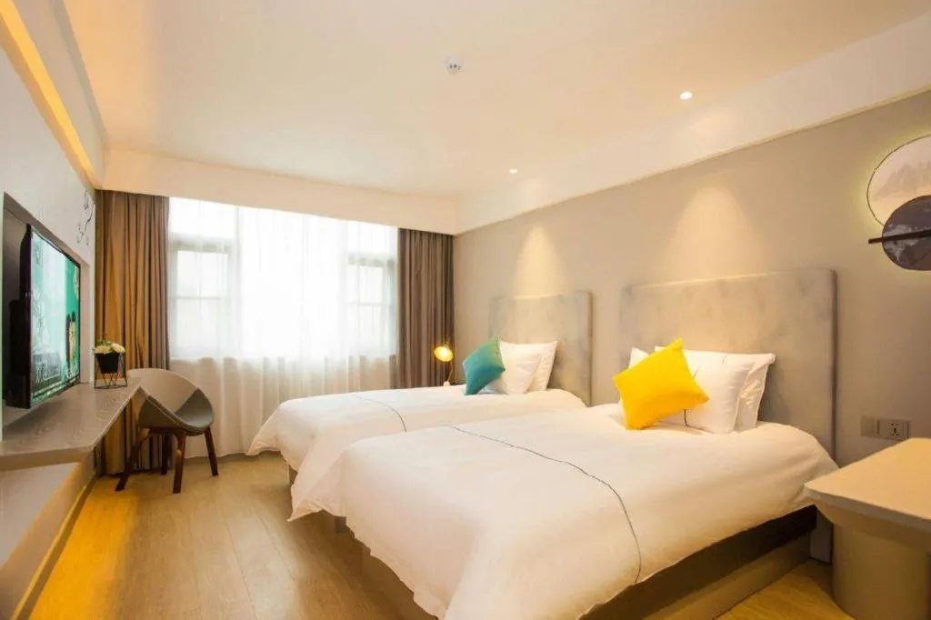 Bed in Magnotel Hotel Suzhou Wanda Plaza Huaihai Road