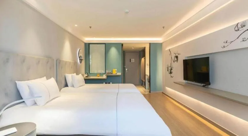 Bed in Magnotel Hotel Suzhou Wanda Plaza Huaihai Road