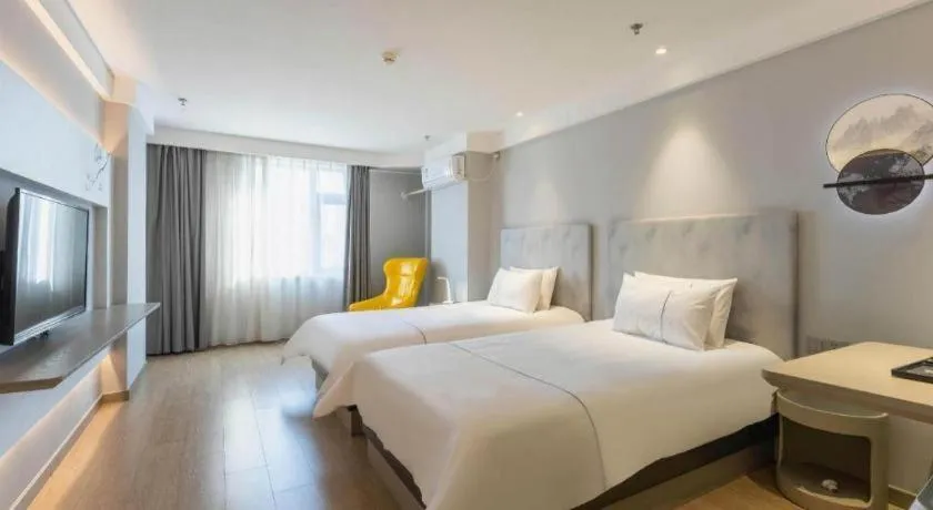 Bed in Magnotel Hotel Suzhou Wanda Plaza Huaihai Road