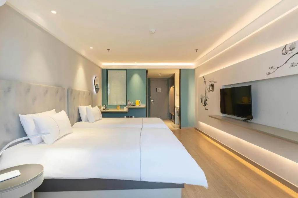 Bed in Magnotel Hotel Suzhou Wanda Plaza Huaihai Road