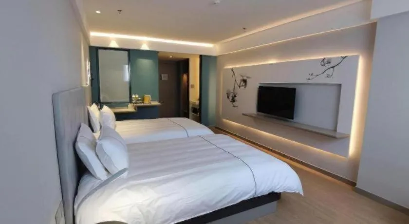 Bed in Magnotel Hotel Suzhou Wanda Plaza Huaihai Road