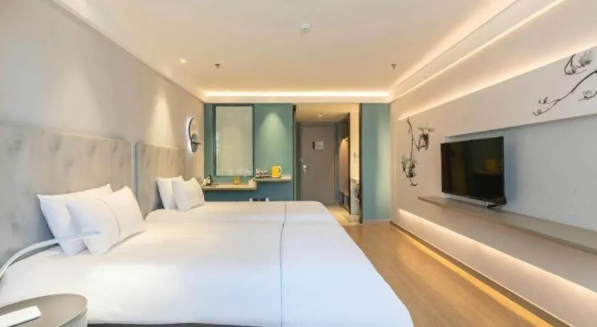 Bed in Magnotel Hotel Suzhou Wanda Plaza Huaihai Road