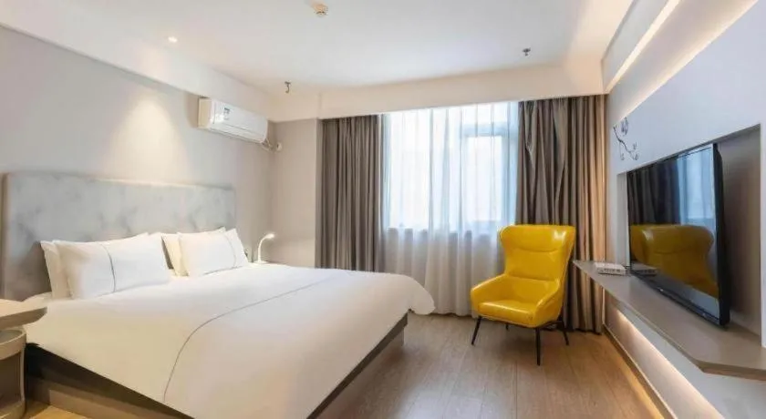 Bed in Magnotel Hotel Suzhou Wanda Plaza Huaihai Road