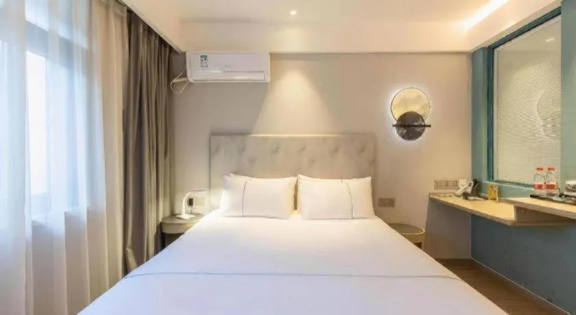 Bed in Magnotel Hotel Suzhou Wanda Plaza Huaihai Road
