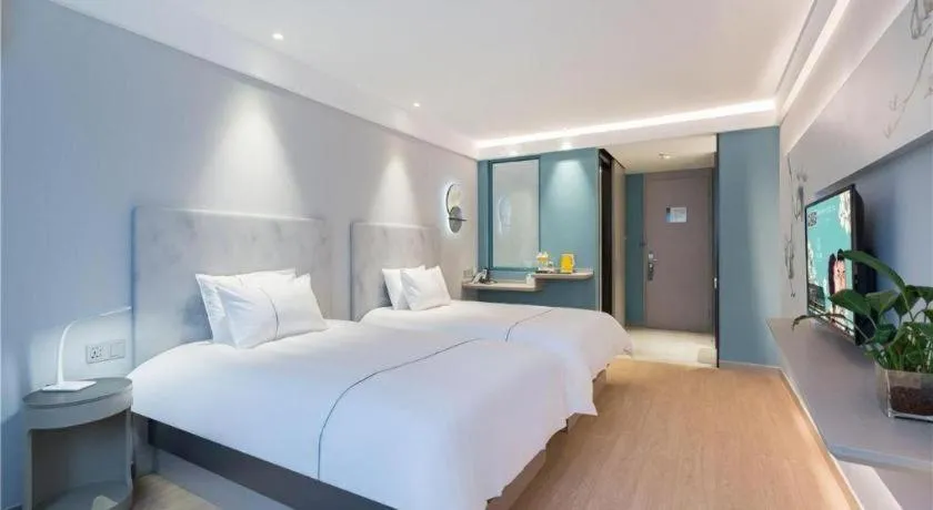 Bed in Magnotel Hotel Suzhou Wanda Plaza Huaihai Road