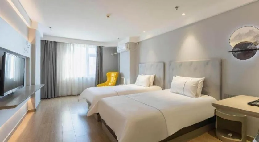 Bed in Magnotel Hotel Suzhou Wanda Plaza Huaihai Road