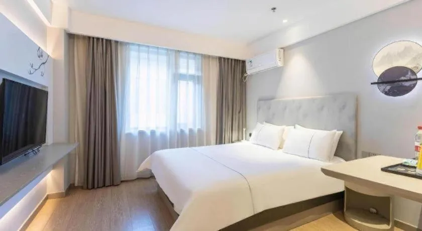 Bed in Magnotel Hotel Suzhou Wanda Plaza Huaihai Road