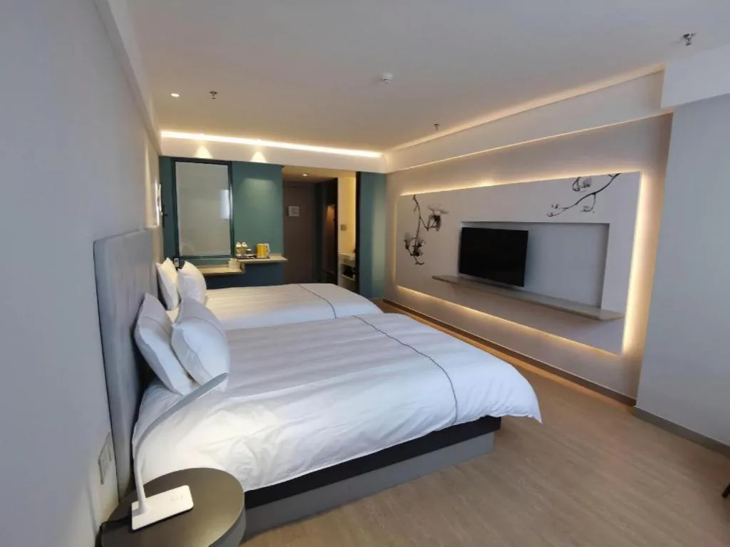 Bed in Magnotel Hotel Suzhou Wanda Plaza Huaihai Road