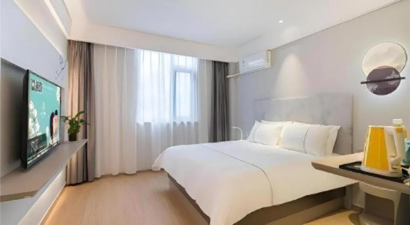 Bed in Magnotel Hotel Suzhou Wanda Plaza Huaihai Road