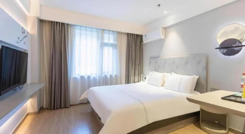 Bed in Magnotel Hotel Suzhou Wanda Plaza Huaihai Road