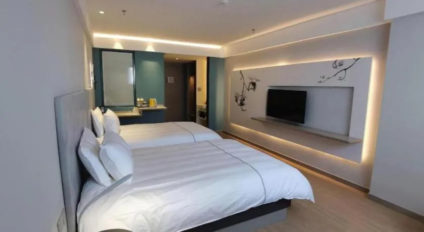 Bed in Magnotel Hotel Suzhou Wanda Plaza Huaihai Road