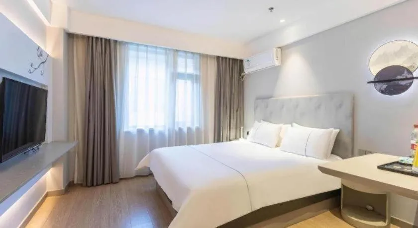 Bed in Magnotel Hotel Suzhou Wanda Plaza Huaihai Road
