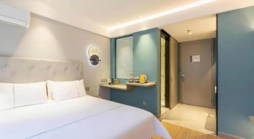 Bed in Magnotel Hotel Suzhou Wanda Plaza Huaihai Road