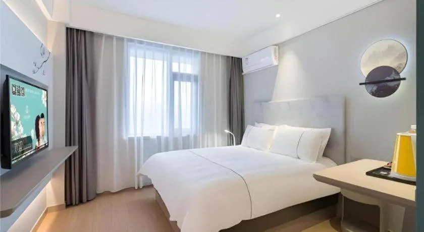 Bed in Magnotel Hotel Suzhou Wanda Plaza Huaihai Road